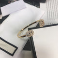 Gucci Gold Running Cubic Zirconia Logo Bangle Bracelets